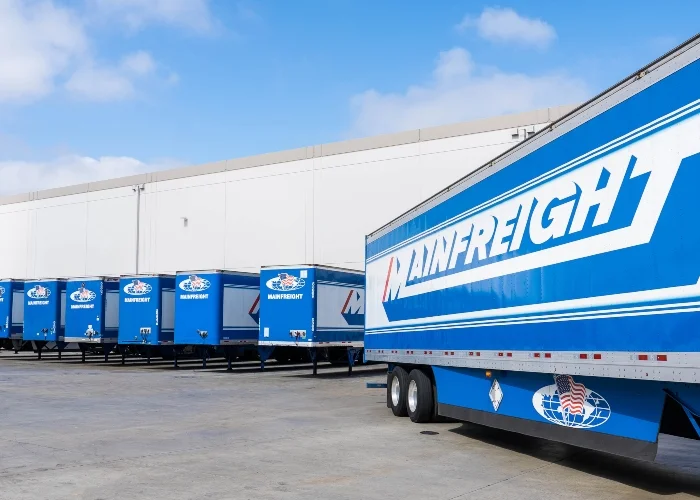 Mainfreight truck with iconic blue branding and curtain sides